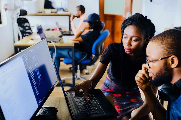 students at laptops (c) unsplash