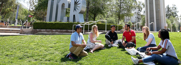 students sitting on lawn (c) UCR/Stan Lim