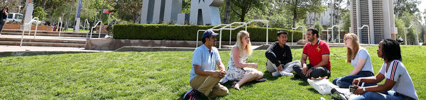 students sitting on lawn (c) UCR/Stan Lim