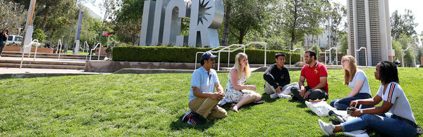 students sitting on lawn (c) UCR/Stan Lim