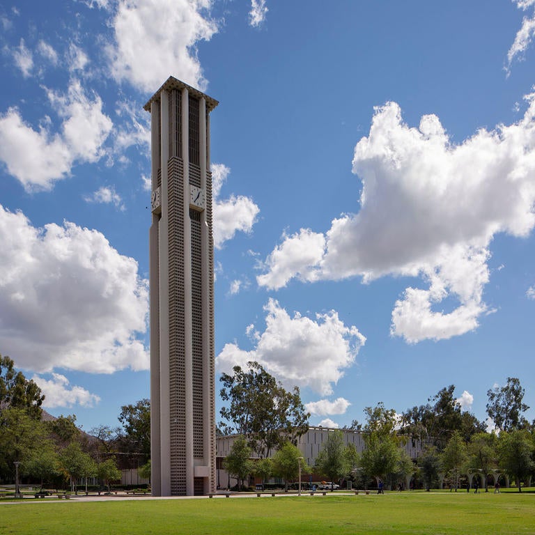 Bell Tower in front of blue sky with clouds (c) UCR/Stan Lim